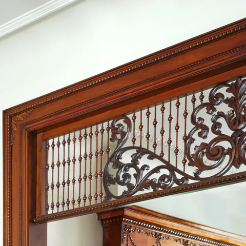 Detail of the original carved wood cased opening between the living room and the cocktail lounge at the Prospect Heights Brownstone, Brooklyn, New York, interior design by Alexandra Peck Design